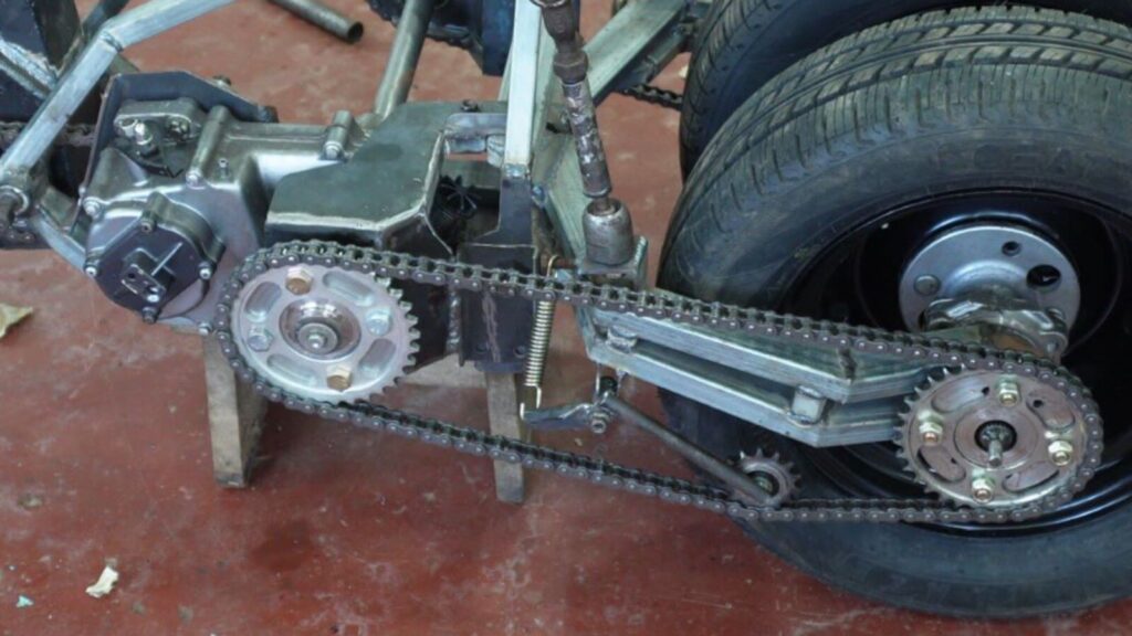 Custom differential and dual chain drive system on a handmade tilting trike motorcycle
