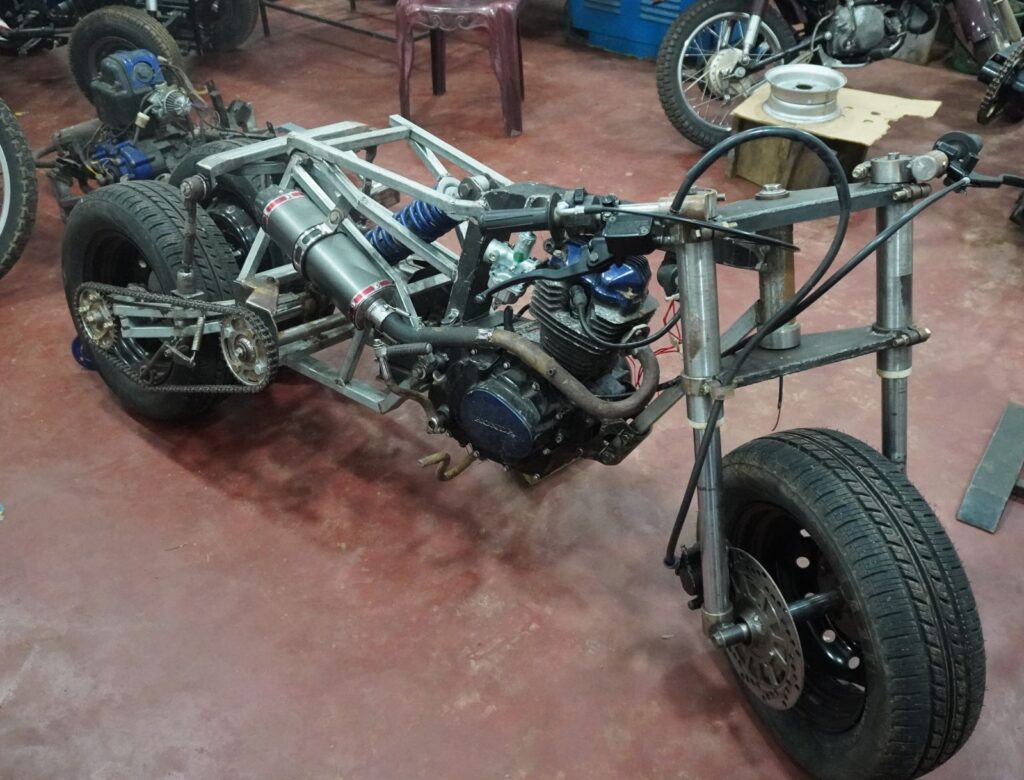 Full handmade tilting trike motorcycle prototype with custom leaning rear suspension system

