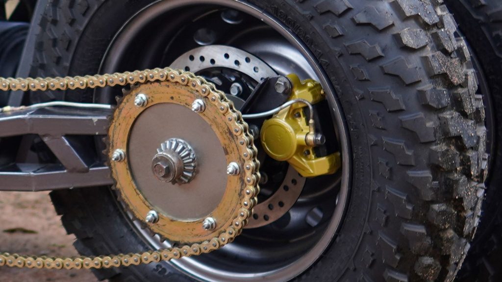 Custom rear disc brake with chain drive and caliper on the Kawasaki ER5 tilting trike.
