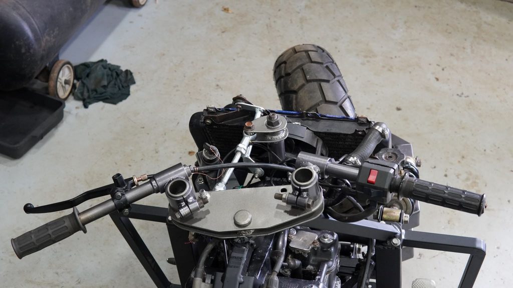 Handlebar steering linkage with eye bearings and custom steering shaft